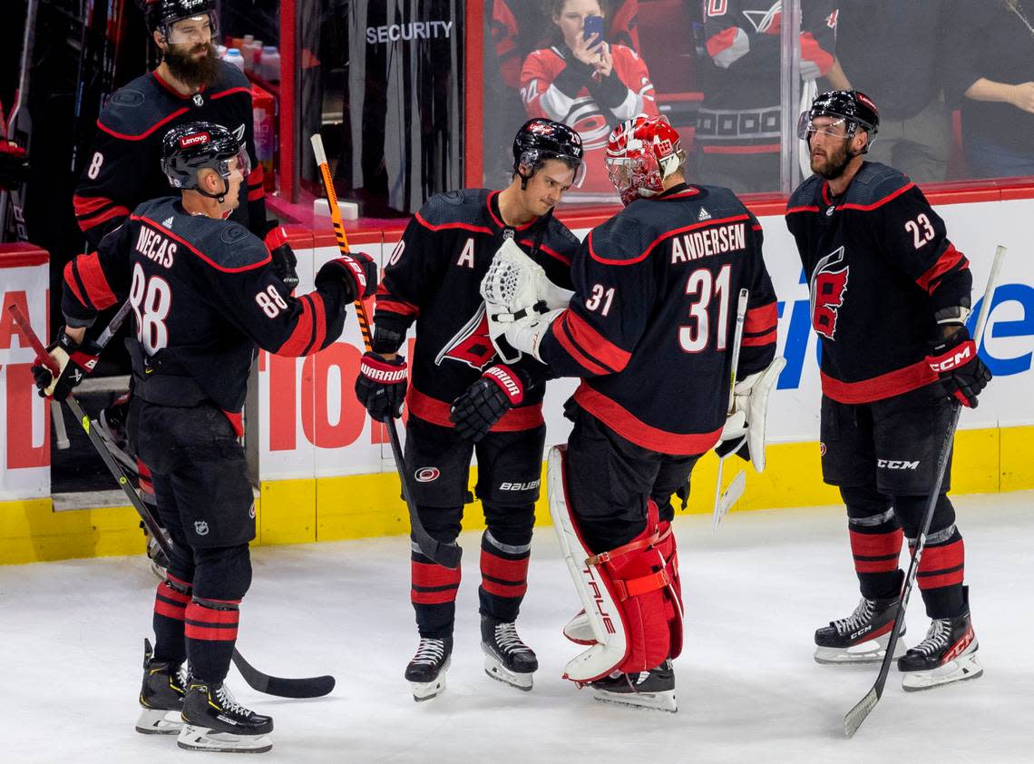 The Carolina Hurricanes Sebastian Aho (20) congratulates goalie Frederik Andersen (31) following their victory over Ottawa on Wednesday, October 11, 2023 at PNC Arena, in Raleigh N.C. Andersen made 27 saves in the Hurricanes’ 5-3 victory. Robert Willett/rwillett@newsobserver.com