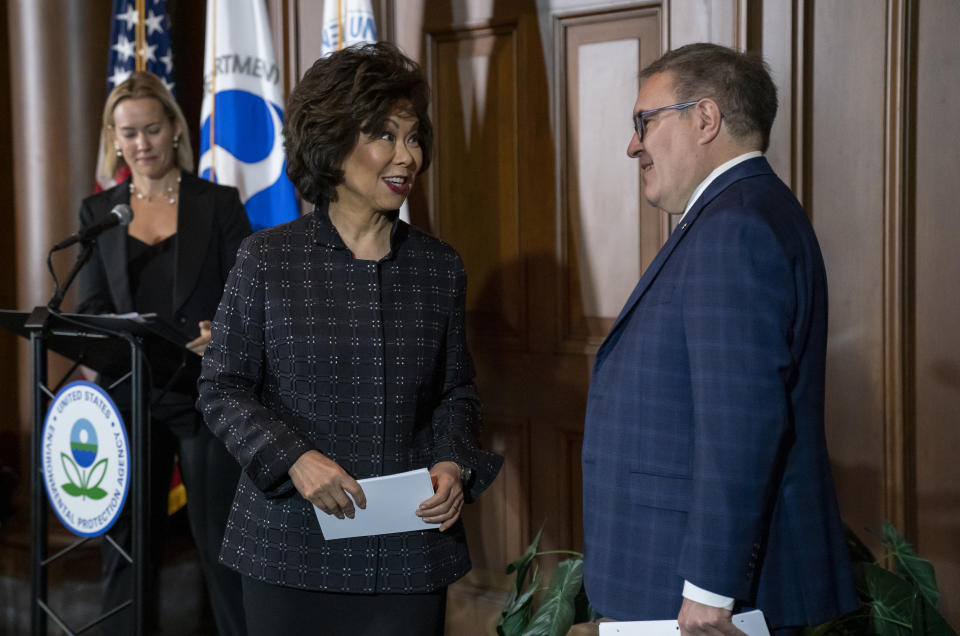 Environmental Protection Agency administrator Andrew Wheeler, right, and Transportation Secretary Elaine Chao speak to reporters about President Donald Trump's decision to revoke California's authority to set auto mileage standards stricter than those issued by federal regulators, at EPA headquarters in Washington, Wednesday, Sept. 18, 2019. (AP Photo/J. Scott Applewhite)