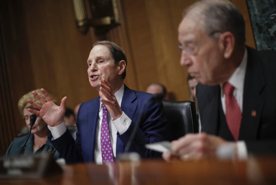 Sen. Ron Wyden, D-Ore., left, gestures while asking questions as Sen. Chuck Grassley, R-Iowa, right, chairman of the Senate Finance Committee, looks on during a hearing with drug company CEOs on drug prices, Tuesday, Feb. 26, 2019 on Capitol Hill in Washington. Also on the committee is Sen. Debbie Stabenow, D-Mich. (AP Photo/Pablo Martinez Monsivais)