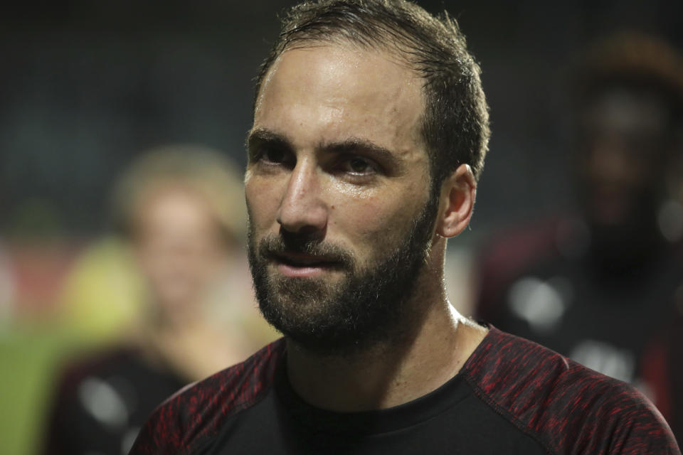 Milan's Gonzalo Higuain, who scored the winning goal, leaves the pitch after a Group F Europa League soccer match between F91 Dudelange and AC Milan at the Josey Barthel stadium in Dudelange, Luxembourg, Thursday, Sept. 20, 2018. (AP Photo/Olivier Matthys)