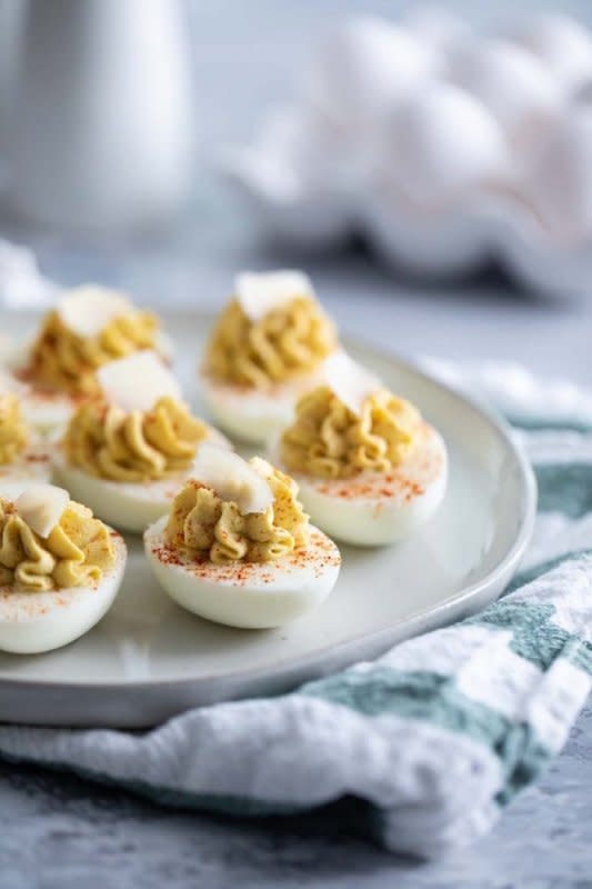 <p>Taste and Tell</p><p>Love Caesar salad? This Caesar deviled eggs recipe has all of the flavors of that Italian salad but in a creamy, delicious deviled egg. These are fun, different appetizers!</p><p><strong>Get the recipe: <a href="https://www.tasteandtellblog.com/cesar-deviled-eggs/" rel="nofollow noopener" target="_blank" data-ylk="slk:Caesar Deviled Eggs;elm:context_link;itc:0;sec:content-canvas" class="link ">Caesar Deviled Eggs</a></strong></p>