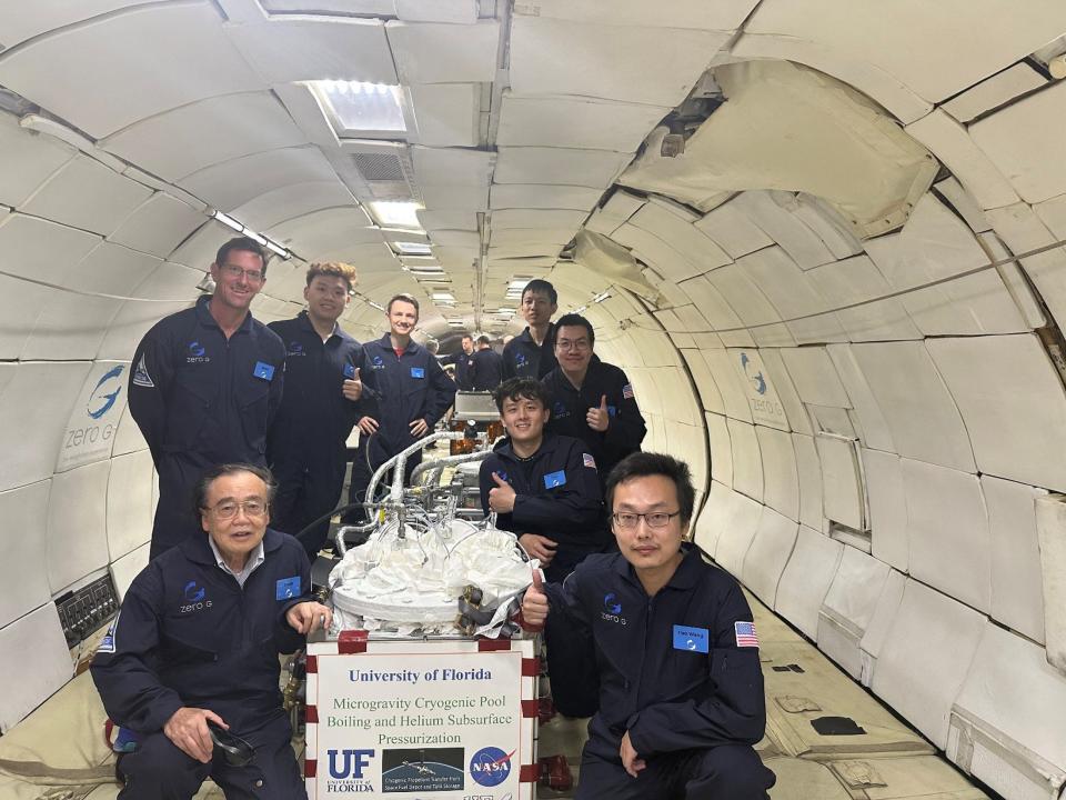 UF 2024 Flight Team poses with the Microgravity Pool Boiling and Helium Subsurface Pressurization Experimental System. The parabolic flight experiment was done in an aircraft to simulate a microgravity environment that can be achieved inside the cabin of an airplane that flies a parabolic trajectory.