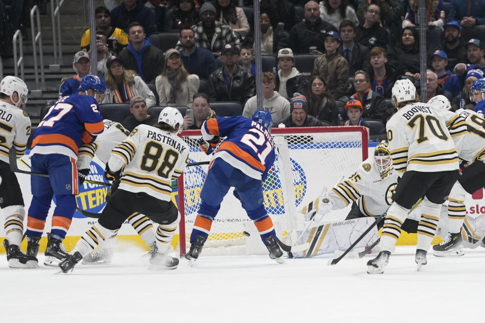 New York Islanders center Kyle Palmieri (21) scores during the first period of an NHL hockey game against the Boston Bruins in Elmont, N.Y., Saturday, March 2, 2024. (AP Photo/Peter K. Afriyie)