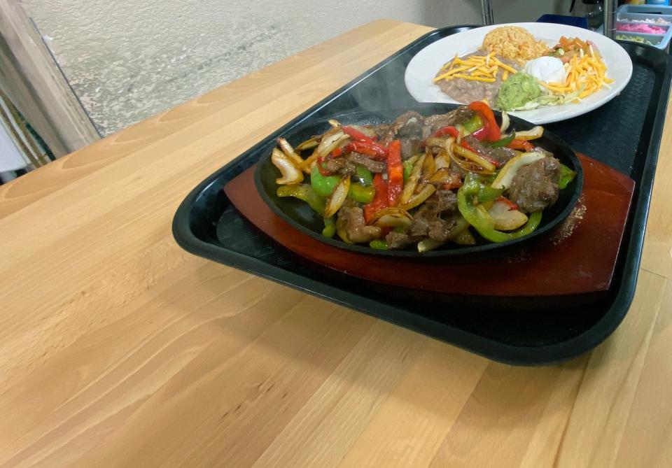 Tex-Mex made fresh from the Little Store and Kitchen in Sherman features fajitas with sides of beans and rice.