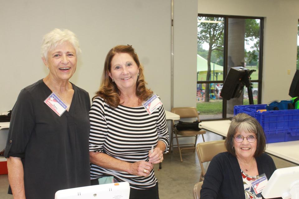 Betty Beckman, Debby Thomas, and Charlene Massey work Tuesday, May 24, 2022 at the Elm Grove Community Center precinct at Martin Luther King Jr. Park in Fort Smith