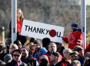 Children hold up a sign of thanks during Remembrance Day ceremonies at the National War Memorial in Ottawa November 11, 2014. REUTERS/Chris Wattie