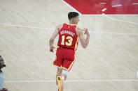 Atlanta Hawks' Bogdan Bogdanovic (13) celebrates after scoring a three-point basket during the first half of Game 3 of the NBA Eastern Conference basketball finals against the Milwaukee Bucks, Sunday, June 27, 2021, in Atlanta. (AP Photo/Brynn Anderson)