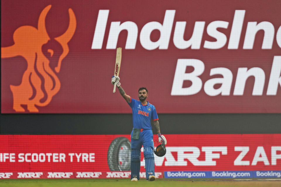 India's Virat Kohli stops to greet the crowd after losing his wicket during the ICC Men's Cricket World Cup first semifinal match between India and New Zealand in Mumbai, India, Wednesday, Nov. 15, 2023. (AP Photo/Rajanish Kakade)