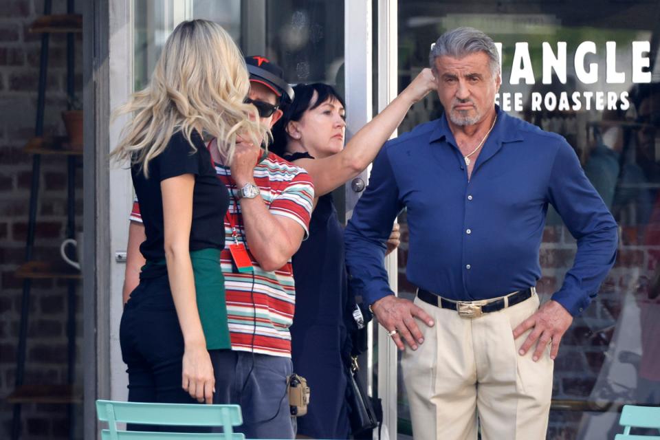 Sylvester Stallone has his hair adjusted on July 11, 2022, before filming a scene of "Tulsa King" at Triangle Coffee Roasters  in downtown Tulsa.