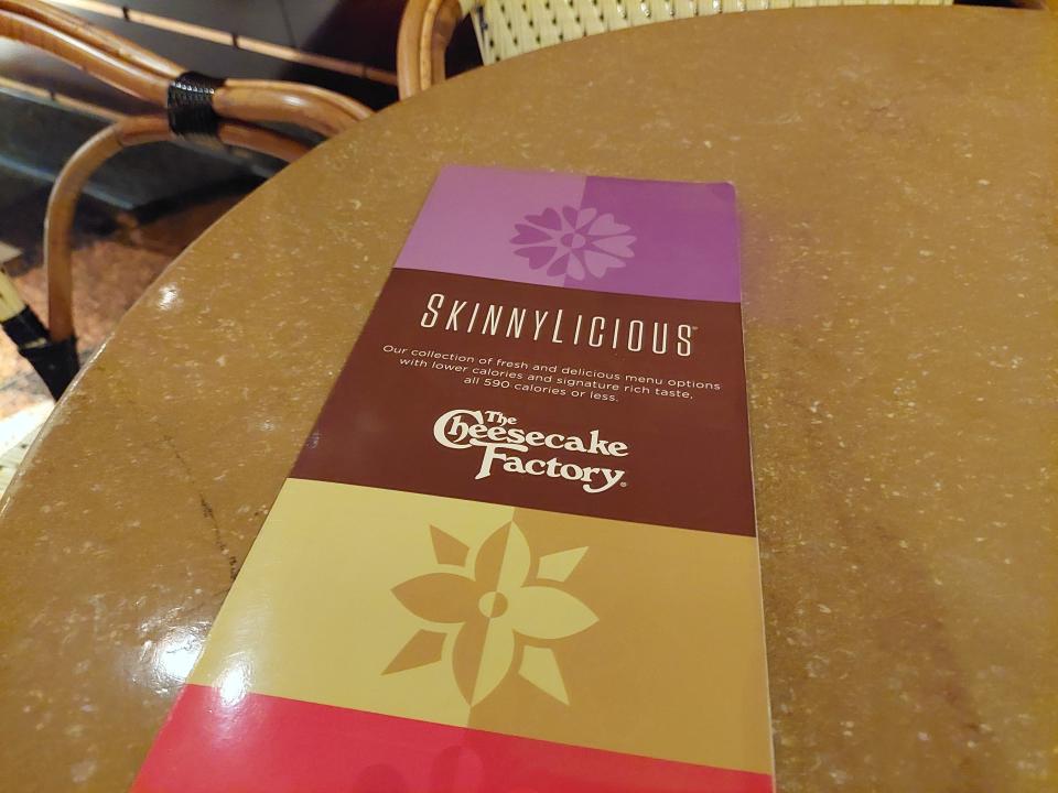 A photo of the front of the Cheesecake Factory's Skinnylicious menu.