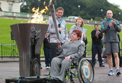 Paralympian athlete Angela Hendra lights the cauldron during a London Paralympic Games ceremony in Belfast on Saturday. Sport for disabled people was pioneered by Ludwig Guttmann at England's Stoke Mandeville hospital