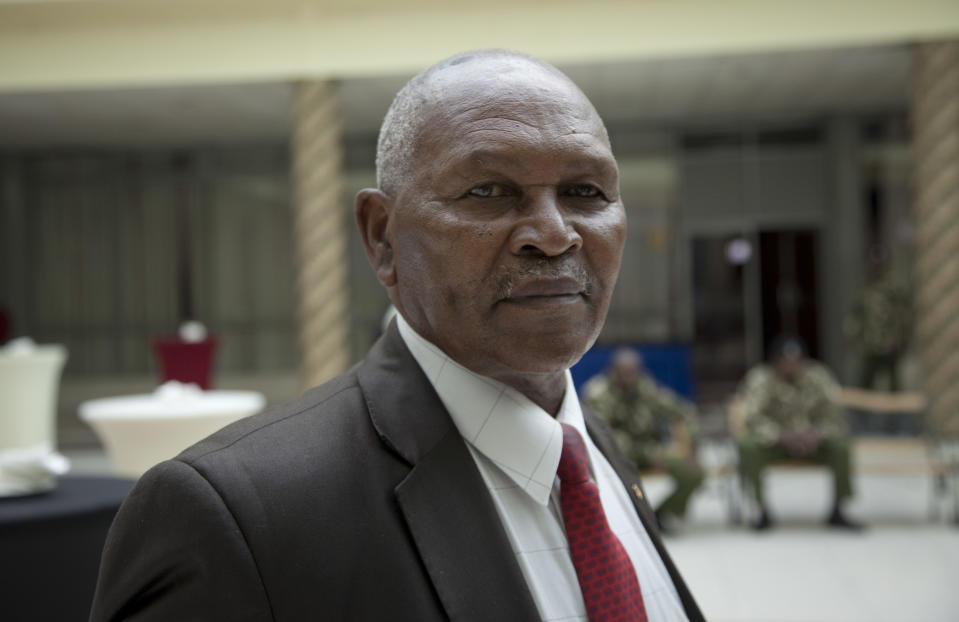 FILE - In this Friday, May 5, 2017 file photo, Incumbent head of Kenya's National Olympic Committee Kipchoge 'Kip' Keino, attends a meeting on the day committee elections were supposed to take place in Nairobi, Kenya. Kenya's director of public prosecutions said on Sunday, Oct. 14, 2018 that distance-running great Keino and six other former officials will be charged with corruption relating to the alleged misappropriation of more than $545,000 that was meant to help fund the country's team at the 2016 Rio de Janeiro Olympics. Keino, a trailblazer for Kenyan runners and a gold medalist at the 1968 Olympics, was head of the national Olympic committee until last year. (AP Photo/Sayyid Abdul Azim, File)