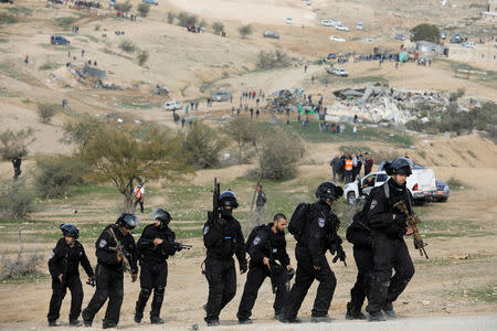 Israeli policemen leave the area following clashes with Arab Israelis in Umm Al-Hiran, a Bedouin village in Israel's southern Negev Desert January 18, 2017. REUTERS/Amir Cohen