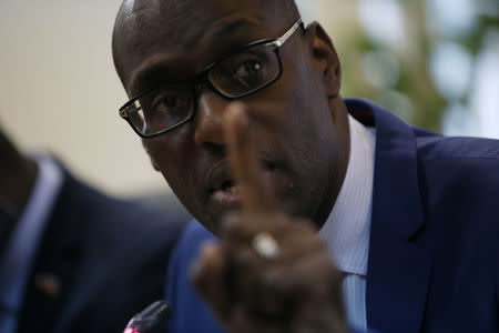 Haiti's Minister of Planning and External Cooperation Aviol Fleurant gestures as he speaks during a news conference about the resolution on the Oxfam scandal in Port-au-Prince, Haiti, June 13, 2018. REUTERS/Andres Martinez Casares