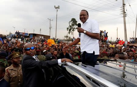 Kenya's President Uhuru Kenyatta addresses his supporters at Burma market after his election win was declared invalid by the Supreme Court in Nairobi, Kenya, September 1, 2017. REUTERS/Thomas Mukoya