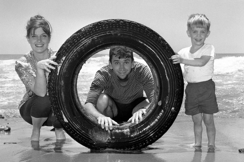 <p>Bob Denver has a little beach day fun with his family and an inflatable in Malibu Beach.</p>