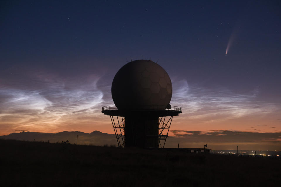 Comet Neowise passes Titterstone Clee Hill Radar and amazing rare Noctilucent clouds behind it on 10 Juy 2020. See SWNS story SWBRcomet; 