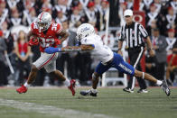 Ohio State running back TreVeyon Henderson, left, cuts upfield against Tulsa defensive back Travon Fuller during the second half of an NCAA college football game Saturday, Sept. 18, 2021, in Columbus, Ohio. (AP Photo/Jay LaPrete)