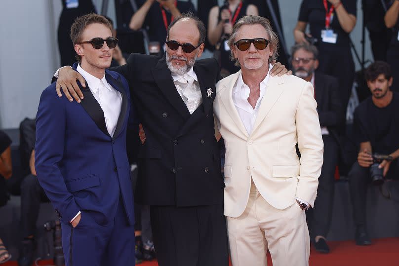 Drew Starkey, from left, director Luca Guadagnino and Daniel Craig pose for photographers upon arrival for the premiere of the film 'Queer'