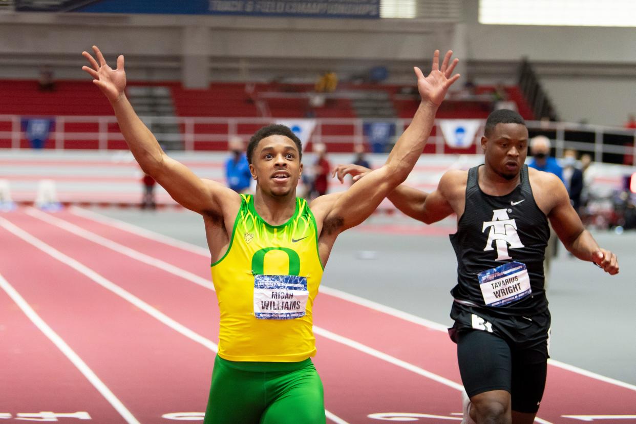 Oregon's Micah Williams celebrates winning the 60 meters during the NCAA indoor track and field championships on March 13, 2021 in Fayetteville, Arkansas. Williams and Oregon are entered in the Texas Tech Open and Multis meet from Thursday through Saturday.