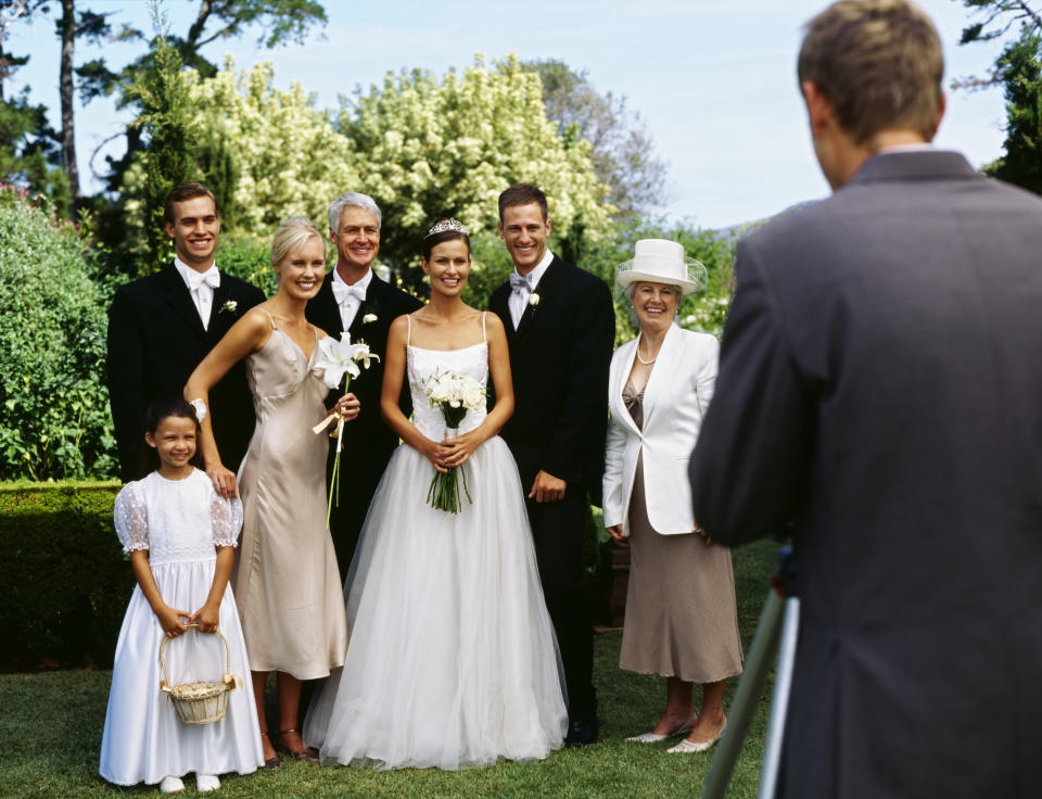 bride and bridal party being photographed