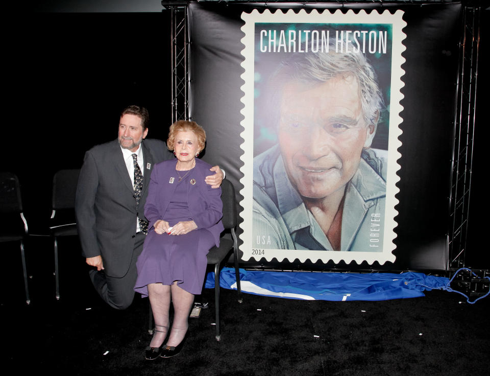 HOLLYWOOD, CA - APRIL 11:  Fraser Heston and his mother Lydia Clarke attends the first-day-of-issue dedication ceremony for the Charlton Heston Forever Stamp at TCL Chinese Theatre on April 11, 2014 in Hollywood, California.  (Photo by Tibrina Hobson/Getty Images)