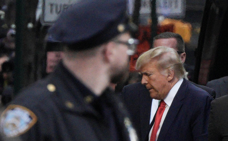 Former U.S. President Donald Trump arrives at Trump Tower, after his indictment by a Manhattan grand jury following a probe into hush money paid to porn star Stormy Daniels, in New York City, U.S April 3, 2023.  REUTERS/Jeenah Moon