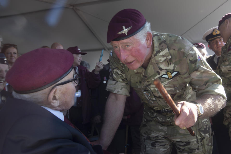 Britain's Prince Charles talks to British 94-year-old British WWII veteran paratrooper Joe Mawthsley, left, at Ginkel Heath, eastern Netherlands, Saturday, Sept. 21, 2019, as part of commemorations marking the 75th anniversary of Operation Market Garden, an ultimately unsuccessful airborne and land offensive that Allied leaders hoped would bring a swift end to World War II by capturing key Dutch bridges and opening a path to Berlin. (AP Photo/Peter Dejong)