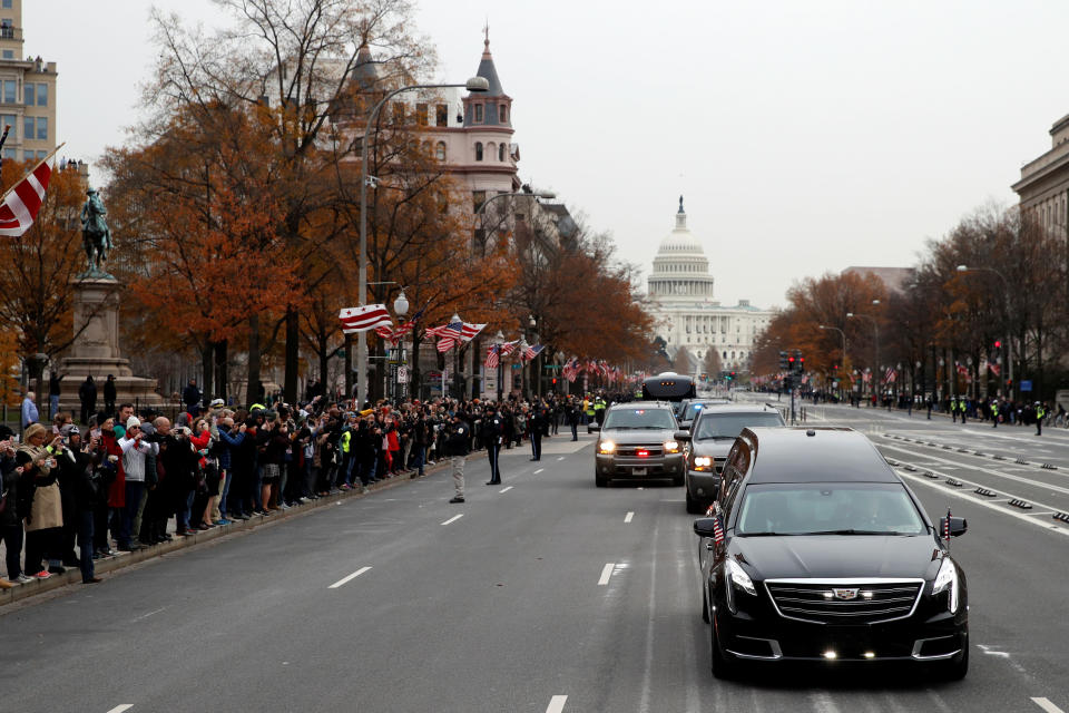 The hearse carrying the flag-draped casket of former President George H.W. Bush heads to a State Funeral at the National Cathedral, Wednesday, Dec. 5, 2018, in Washington. (Photo: Alex Brandon/Pool via Reuters)