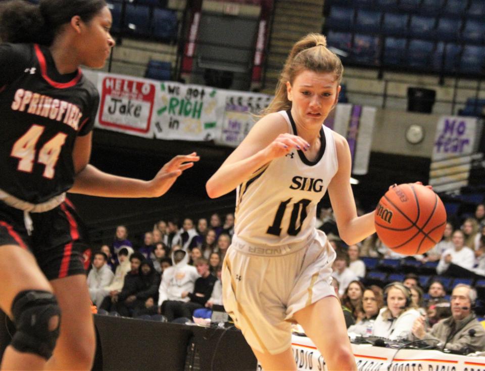 Sacred Heart-Griffin's Maggie Fleischli runs down the court against Springfield High's Aniyah Rhinehouse during the first game of the City girls basketball tournament at the Bank of Springfield Center on Wednesday, Jan. 25, 2023.