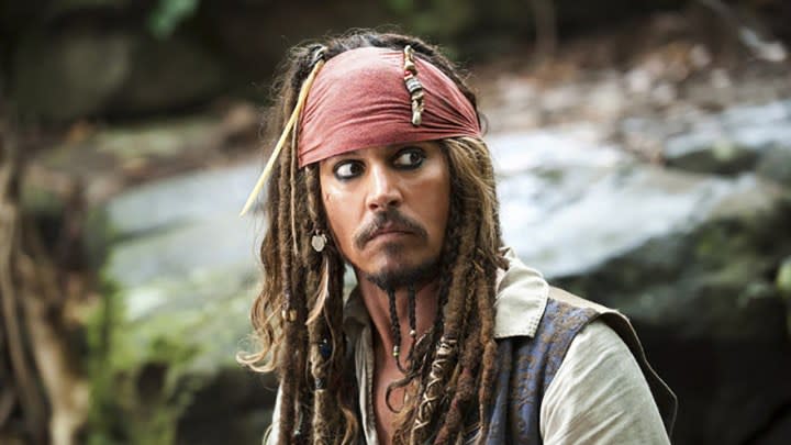 Johnny Depp as Captain Jack Sparrow in Pirates of the Caribbean, looking off to the side suspiciously.