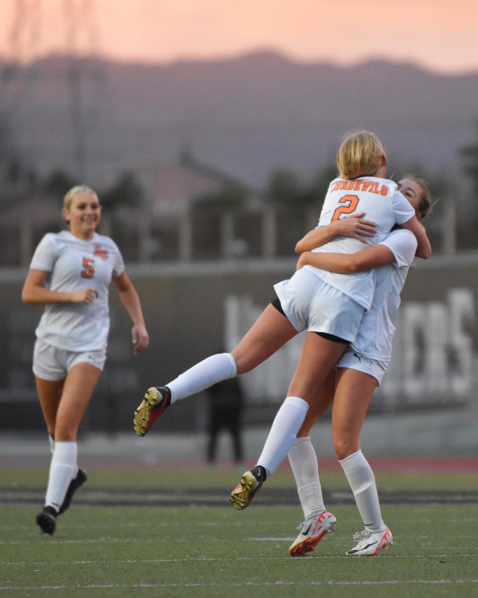 Apple Valley’s Bailey Richer is lifted up by teammate Abigail Riley after scoring on a free kick during the first half of the CIF State Southern California Regional Division 3 championship game on Saturday, March 2, 2024. Apple Valley lost to Granada Hills Charter in penalty kicks.