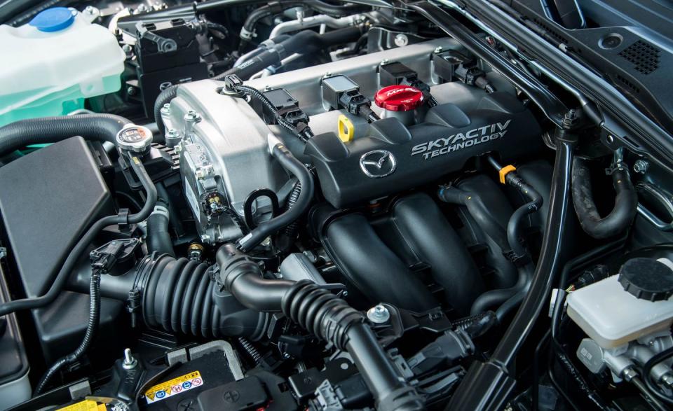 <p>Mazda might have philosophical reasons for maintaining a balance between the Miata's power and its handling capability, but more power is always welcome. For 2019, every Miata's 2.0-liter engine gets just that, in the form of an additional 31 horsepower delivered between 6800 rpm-the '18 Miata's redline-and its new 7500-rpm redline. Regardless of engine speed, the new 2.0-liter is incredibly smooth, almost Honda-like, thanks to a thorough re-engineering of nearly every major and minor component, shaving reciprocating mass and smoothing out the breathing channels.</p>