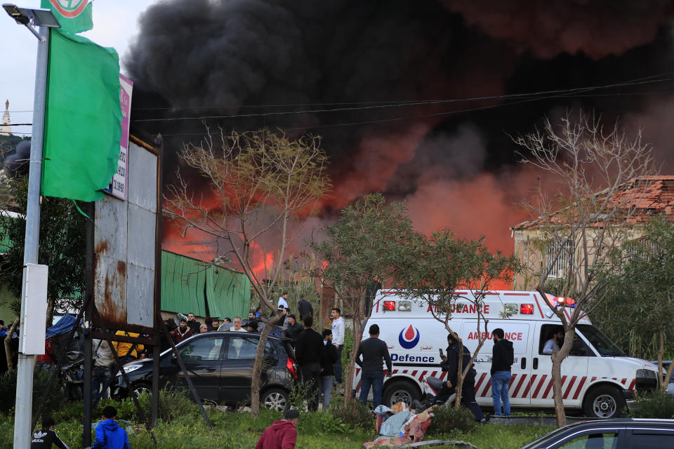 Black smoke and flames rise from an industrial district that attacked by Israeli strikes, in the southern coastal town of Ghazieh, Lebanon, Monday, Feb. 19, 2024. Israel's air force carried out at least two airstrikes near the southern port city of Sidon in one of the largest attacks near a major city, state media reported. (AP Photo/Mohammed Zaatari)