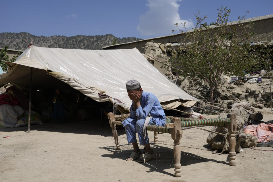 Afghan boy sits in a courtyard of her destroyed home after an earthquake in Gayan district in Paktika province, Afghanistan, Sunday, June 26, 2022. A powerful earthquake struck a rugged, mountainous region of eastern Afghanistan early Wednesday, flattening stone and mud-brick homes in the country's deadliest quake in two decades, the state-run news agency reported. (AP Photo/Ebrahim Nooroozi)