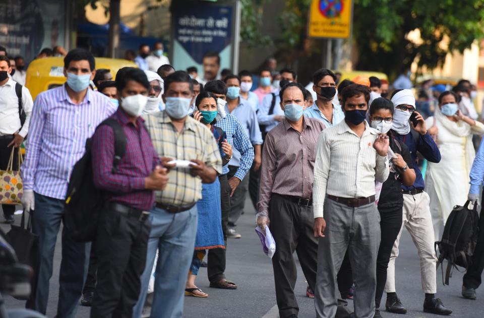 NEW DELHI, INDIA - JUNE 8: Commuters waiting for a DTC bus to roll in at Rajiv Chowk, on June 8, 2020 in New Delhi, India. (Photo by Raj K Raj/Hindustan Times via Getty Images)