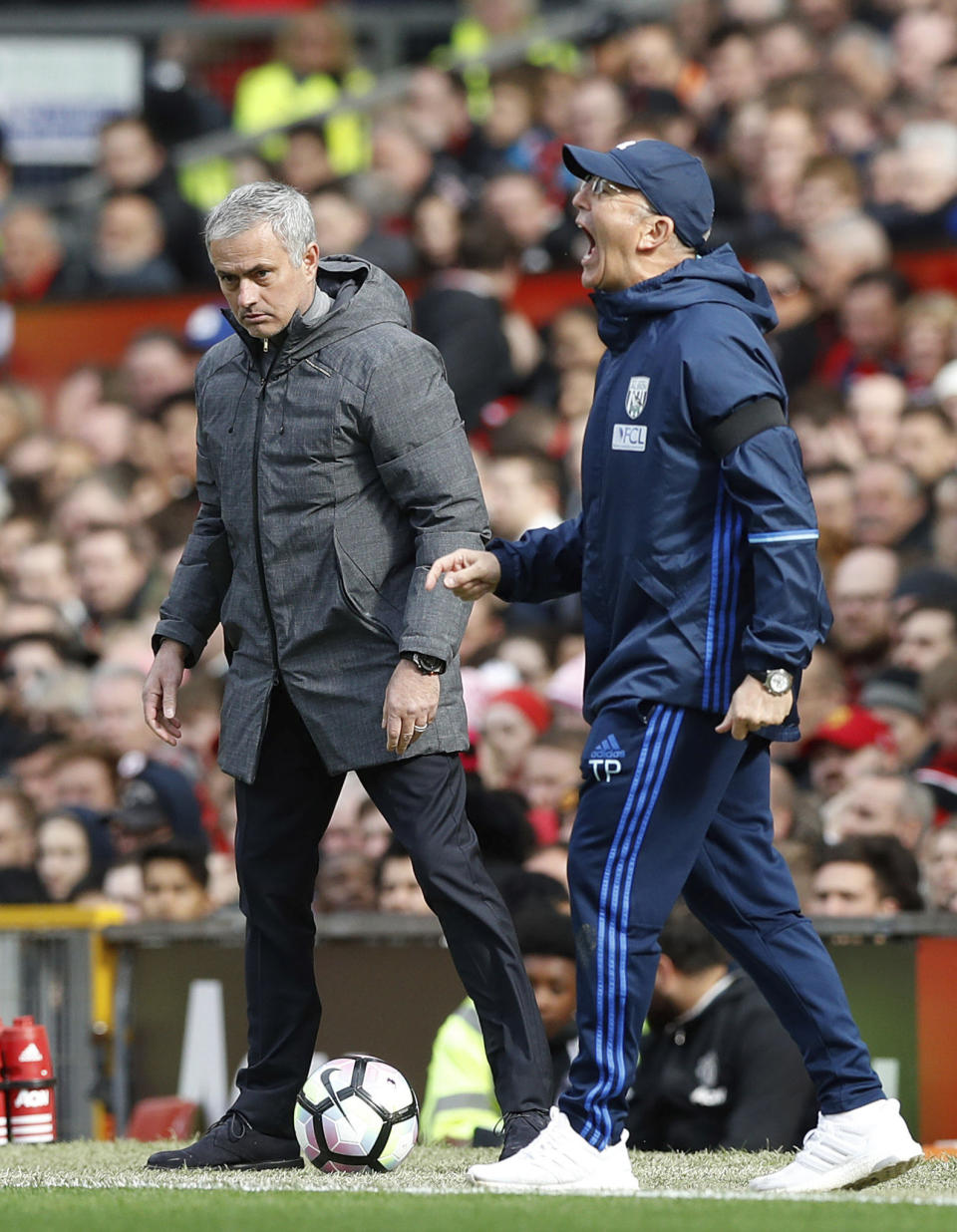 <p>Manchester United manager Jose Mourinho, left, and West Bromwich Albion manager Tony Pulis look on during the English Premier League soccer match at Old Trafford in Manchester, England, Saturday April 1, 2017. (Martin Rickett/PA via AP) </p>