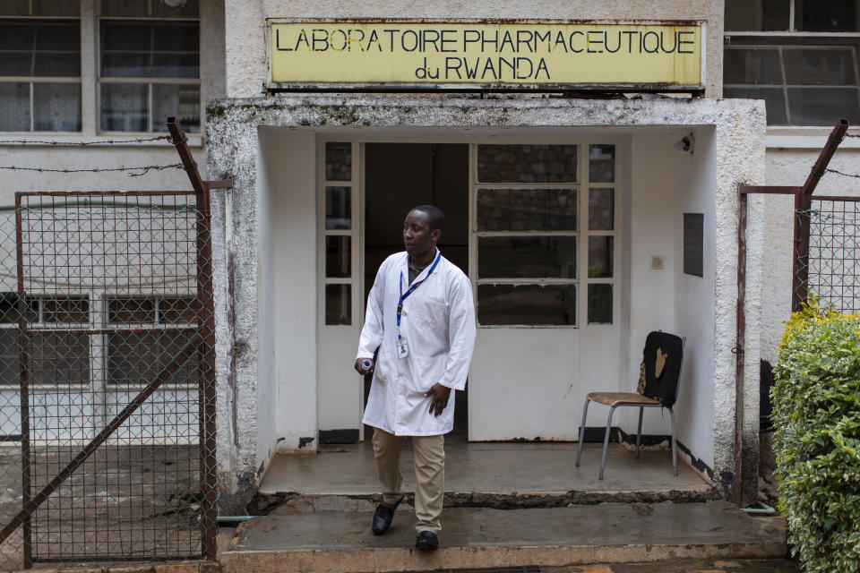 In this photo taken Thursday, Nov. 7, 2019, Richard Niwenshuti Gatera, a pharmacist and director at the Pharmaceutical Laboratory of Rwanda where the country's liquid morphine is made from powder, stands outside the facility in Butare, Rwanda. While people in rich countries are dying from overuse of prescription painkillers, people in Rwanda and other poor countries are suffering from a lack of them, but Rwanda has come up with a solution to its pain crisis - it's morphine, which costs just pennies to produce and is delivered to households across the country by public health workers. (AP Photo/Ben Curtis)