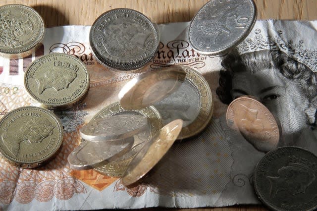 File photo dated 16/01/07 of money as it has been announced that the Living Wage is to increase by 20p to ï¿½7.85 an hour, boosting the pay of 35,000 workers. PRESS ASSOCIATION Photo. Issue date: Monday November 3, 2014. The new figure was revealed as a new study showed that 5.2 million people, or 22% of the workforce, are paid less than the Living Wage - an increase of 1% over the past year. The number of employers who have signed up to pay the Living Wage has more than doubled this year to over 1,000, including 18 in the FTSE 100, such as Standard Life and Canary Wharf Group. See PA story INDUSTRY Wage. Photo credit should read: Owen Humphreys/PA Wire