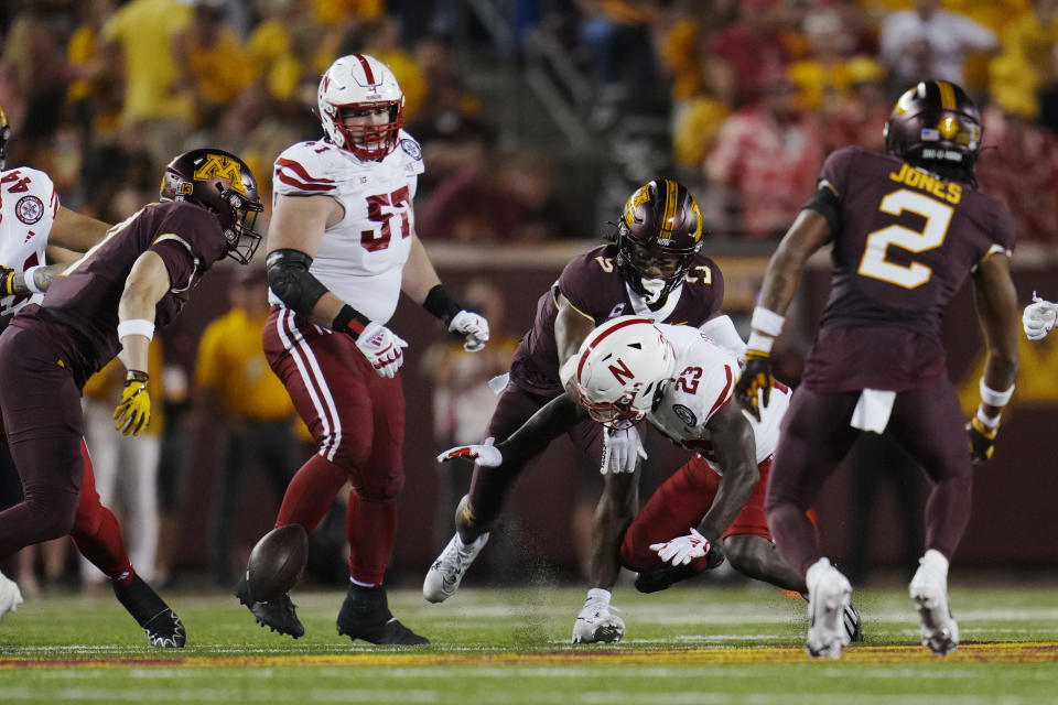 Nebraska running back Anthony Grant (23) fumbles the football during the second half of the team's NCAA college football game against Minnesota, Thursday, Aug. 31, 2023, in Minneapolis. (AP Photo/Abbie Parr)