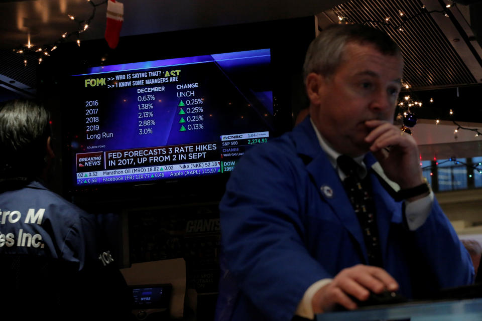 FTSE Traders work on the floor of the New York Stock Exchange (NYSE) shortly after the announcement that the U.S. Federal Reserve will hike interest rates in New York, U.S., December 14, 2016.  REUTERS/Lucas Jackson