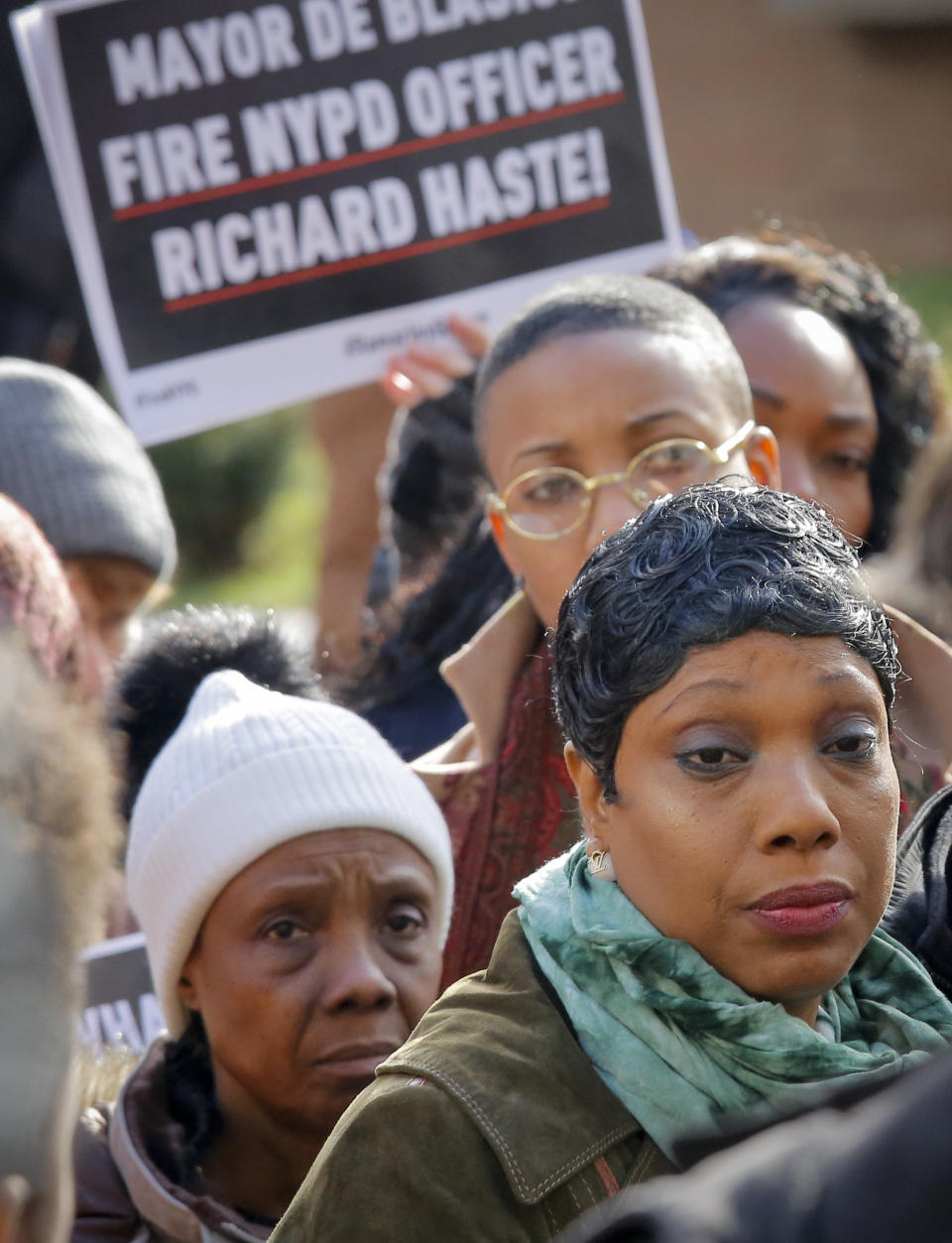 Constance Malcolm, right, mother of police shooting victim Ramarley Graham, and her mother Patricia Hartley, left, listen during a press conference outside police headquarters, Thursday Jan. 19, 2017, in New York. A disciplinary trial is underway at police headquarters for NYPD officer Richard Haste, who shot and killed the unarmed 18-year-old Graham in the bathroom of his New York City apartment with his grandmother present. (AP Photo/Bebeto Matthews)