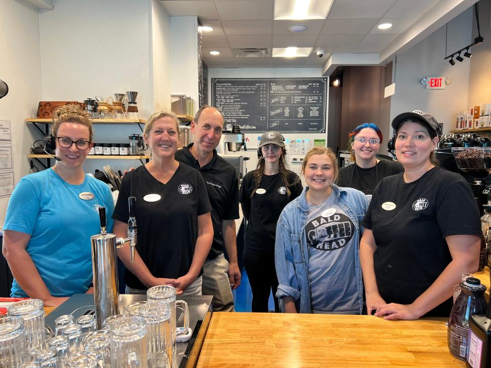 Bald Head Coffee and Tea House owners Pam and Steve Lewis are pictured with their staff on Tuesday, October 17, 2023.