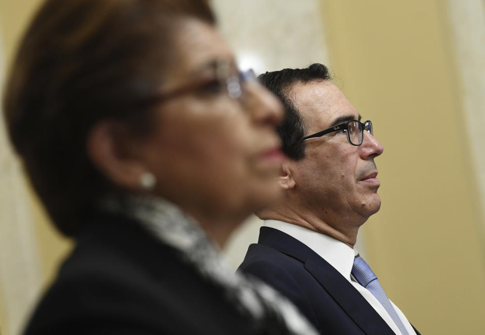 Treasury Secretary Steven Mnuchin waits to testify before a Senate Small Business and Entrepreneurship hearing to examine implementation of Title I of the CARES Act, Wednesday, June 10, 2020 on Capitol Hill in Washington. (Kevin Dietsch/Pool via AP)