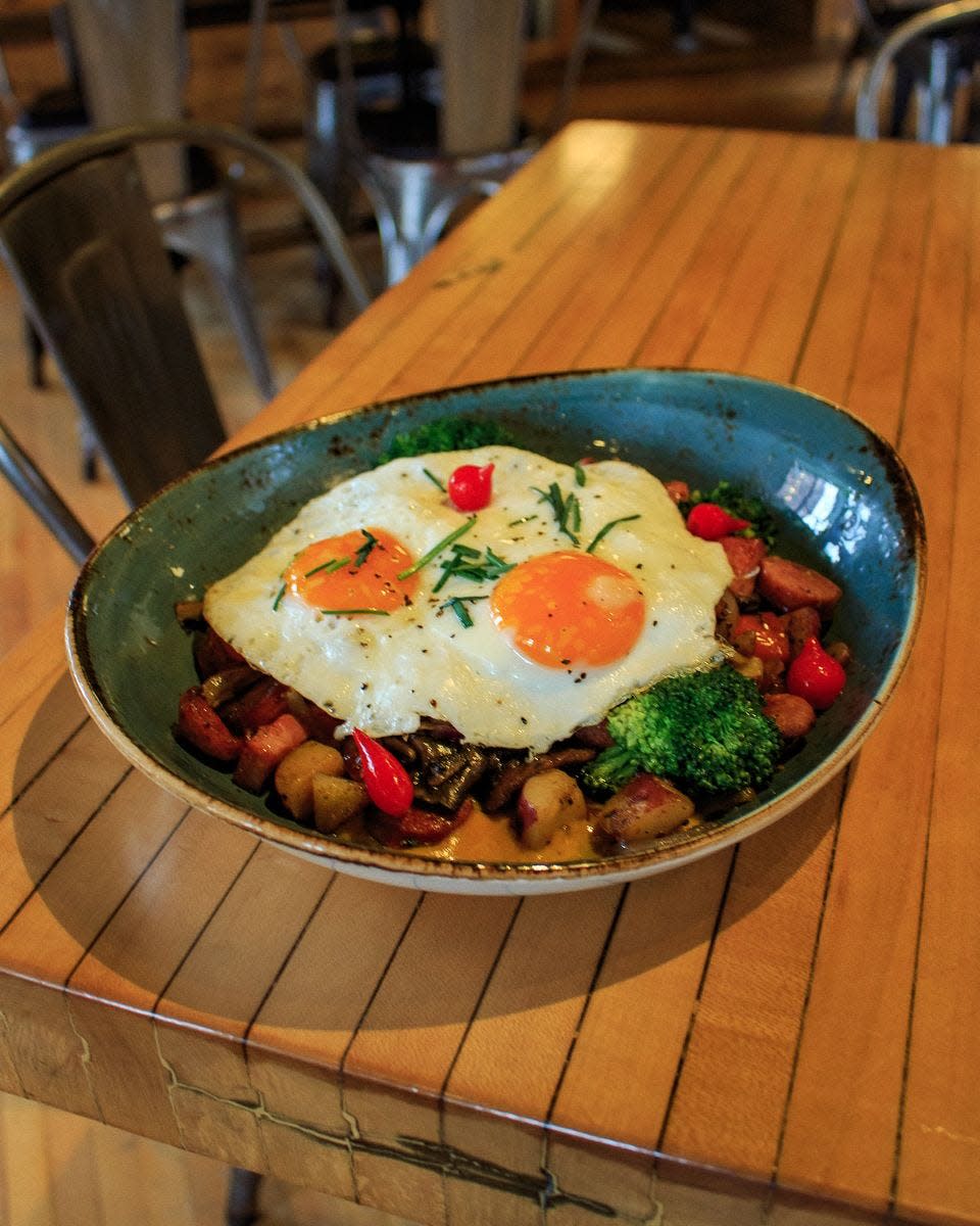 Café Benelux's Easter menu includes a duck sausage hash with smoked duck and badger ham, broccoli and breakfast potatoes, topped with sunny side up eggs.