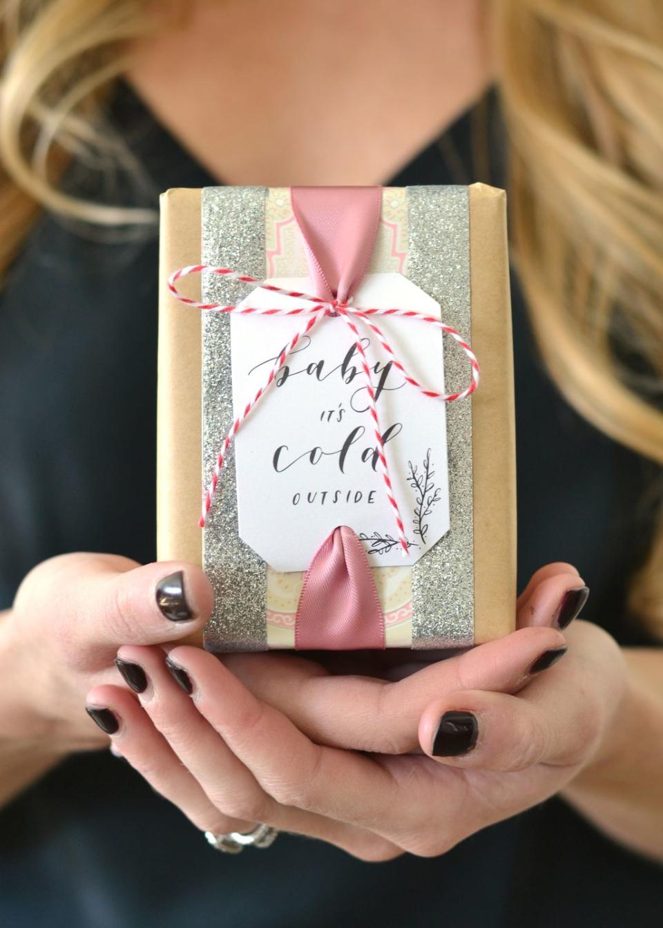 <p>With a tag that shares the title of a classic holiday song, sparkling silver washi tape, and pink ribbon, your gift will look just as sweet as can be.<br></p><p><strong>Get the tutorial at <a href="https://boxwoodavenue.com/gapxdarbysmart-gift-wrap/" rel="nofollow noopener" target="_blank" data-ylk="slk:Boxwood Avenue;elm:context_link;itc:0;sec:content-canvas" class="link ">Boxwood Avenue</a>. </strong> </p>