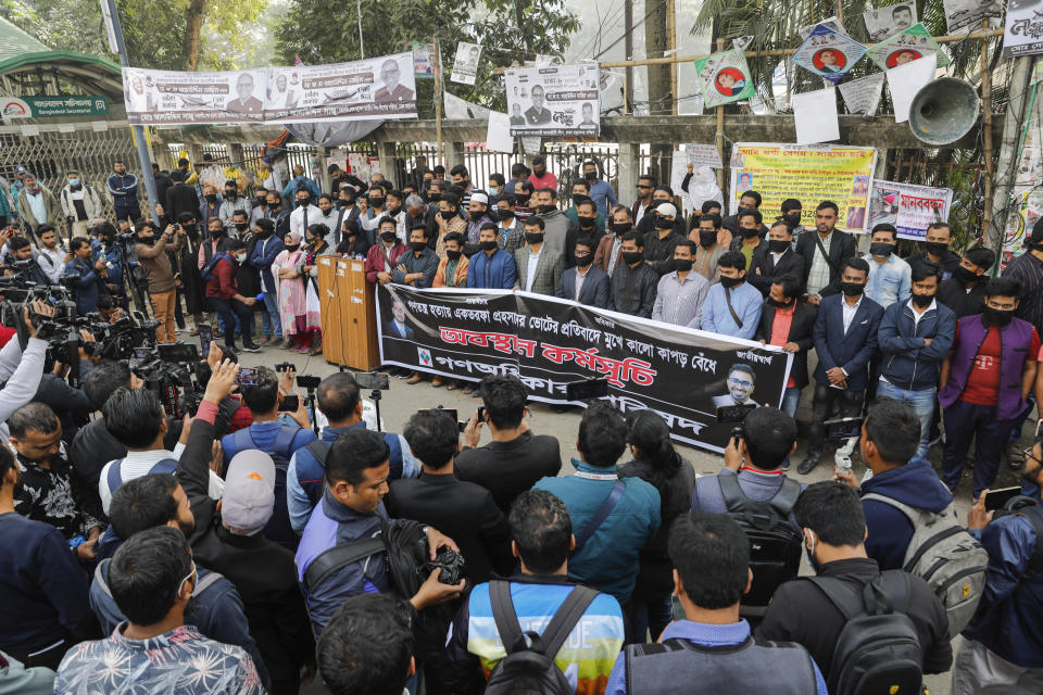 Activists of Gono Odhikar Parishad stand wearing black clothes on the face to protest against what they called a one sided election at the National Press Club in Dhaka, Bangladesh, Monday, Jan.8, 2024. Prime Minister Sheikh Hasina has won an overwhelming majority in Bangladesh's parliamentary election after a campaign fraught with violence and a boycott from the main opposition party, giving her and her Awami League a fourth consecutive term. (AP Photo/Mahmud Hossain Opu)