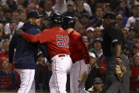 Boston Red Sox manager Alex Cora argues a call with home plate umpire Laz Diaz during the third inning in Game 4 of baseball's American League Championship Series Houston Astros Tuesday, Oct. 19, 2021, in Boston. (AP Photo/Winslow Townson)