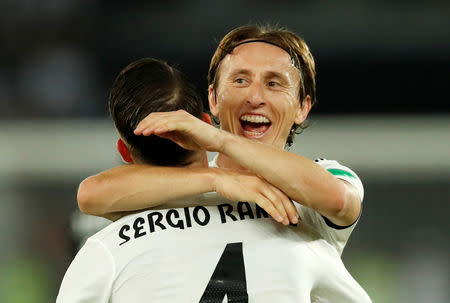 Soccer Football - Club World Cup - Final - Real Madrid v Al Ain - Zayed Sports City Stadium, Abu Dhabi, United Arab Emirates - December 22, 2018 Real Madrid's Sergio Ramos celebrates scoring their third goal with Luka Modric REUTERS/Andrew Boyers