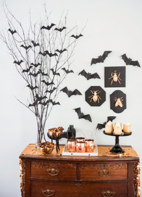<p>The Sweetest Occasion</p><p>If you’re looking to give your cocktail tables a little bit more of an eerie vibe, check out this easy and spooky centerpiece from <a href="https://thesweetestoccasion.com/2016/10/diy-halloween-centerpiece/" rel="nofollow noopener" target="_blank" data-ylk="slk:The Sweetest Occasion;elm:context_link;itc:0;sec:content-canvas" class="link ">The Sweetest Occasion</a>!</p>